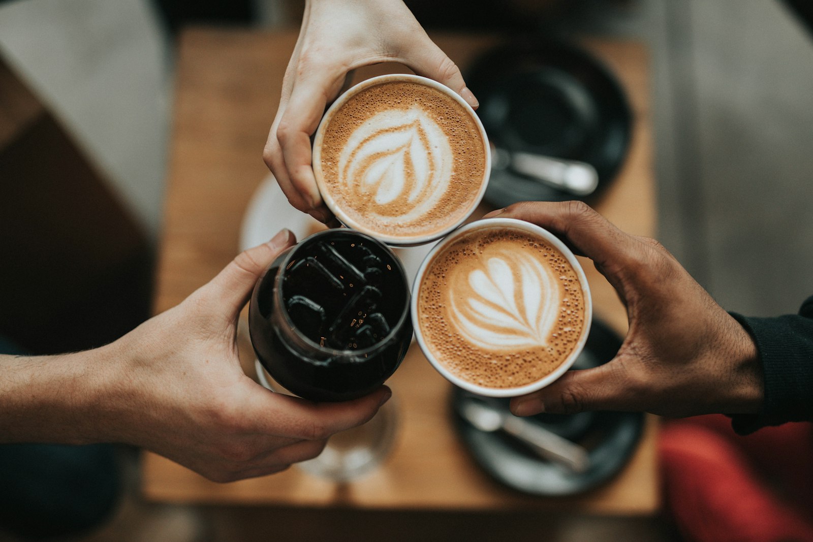 Guests holding cups together.
